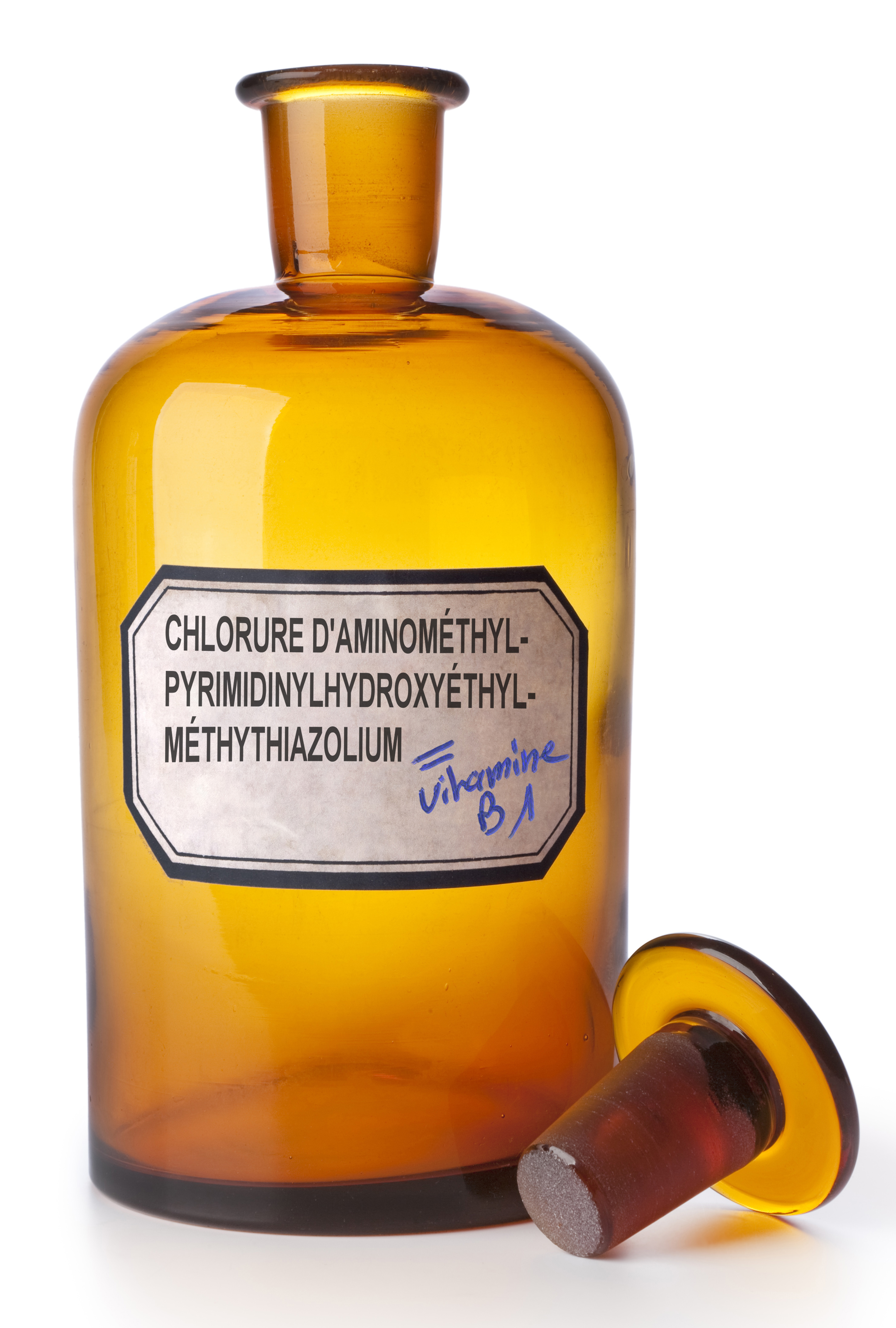 Medicine bottle with an empty label on white background